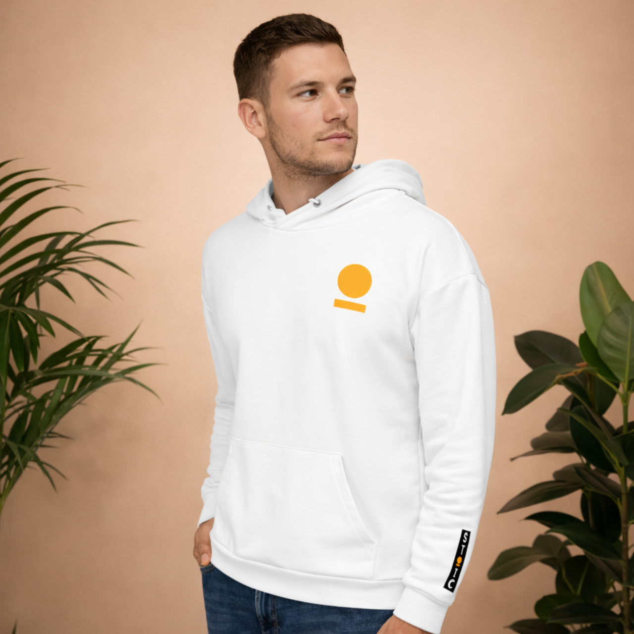 Man wearing a white STOIC hoodie with embroidered logo on chest and wrist against a beige background