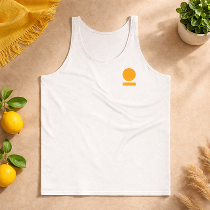 White STOIC tank top with logo on a beige surface with lemons and a plant.
