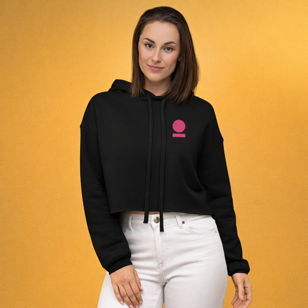 Woman wearing black STOIC cropped hoodie with embroidered logo on the left chest.
