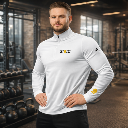 Man wearing a white embroidered STOIC Quarter-Zip pullover with logo on his left chest and left wrist in a gym setting.