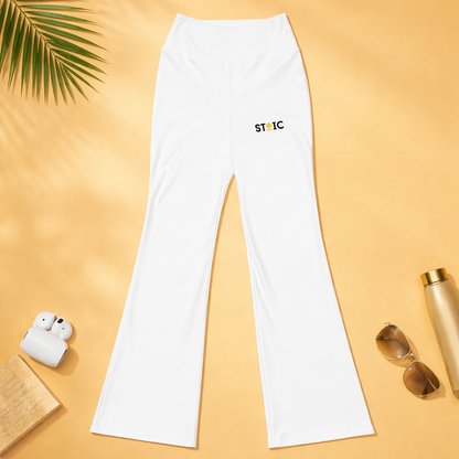 White leggings pants with 'STOIC' logo on left upper thigh on a yellow background with accessories.