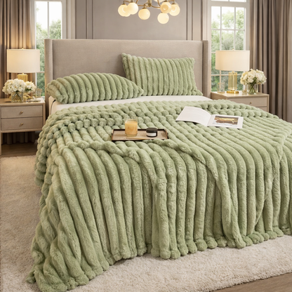 Green grounding throw on a bed in a well-lit bedroom