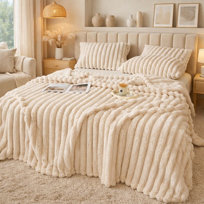 Bedroom with a bed covered in a grounding throw and pillows.