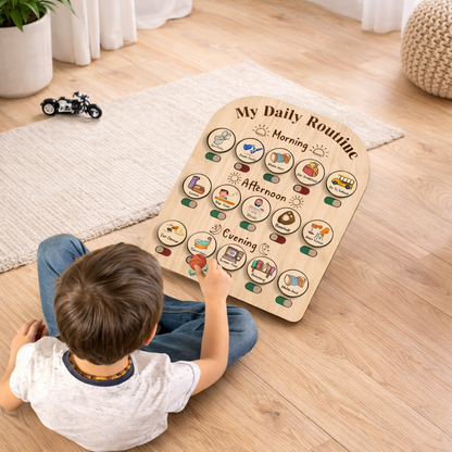 Child playing with a wooden daily routine chart on a wooden floor.
