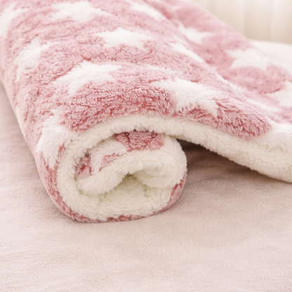 Roll of pink and white fleece Flannel Pet sleeping Mat on a light background