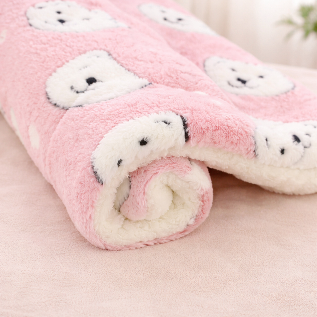 Pink fleece Flannel Pet Sleeping Mat with white cat faces pattern on a light pink background