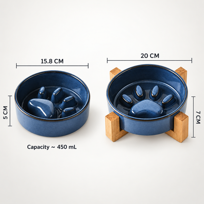 Two blue ceramic pet bowls with paw-print designs, shown with dimension labels and capacity text on a light background. One bowl is shown without a stand (15.