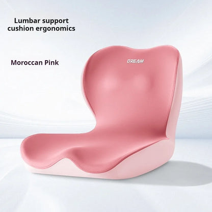 Pink lumbar support cushion with 'Dream' branding on a light gray background