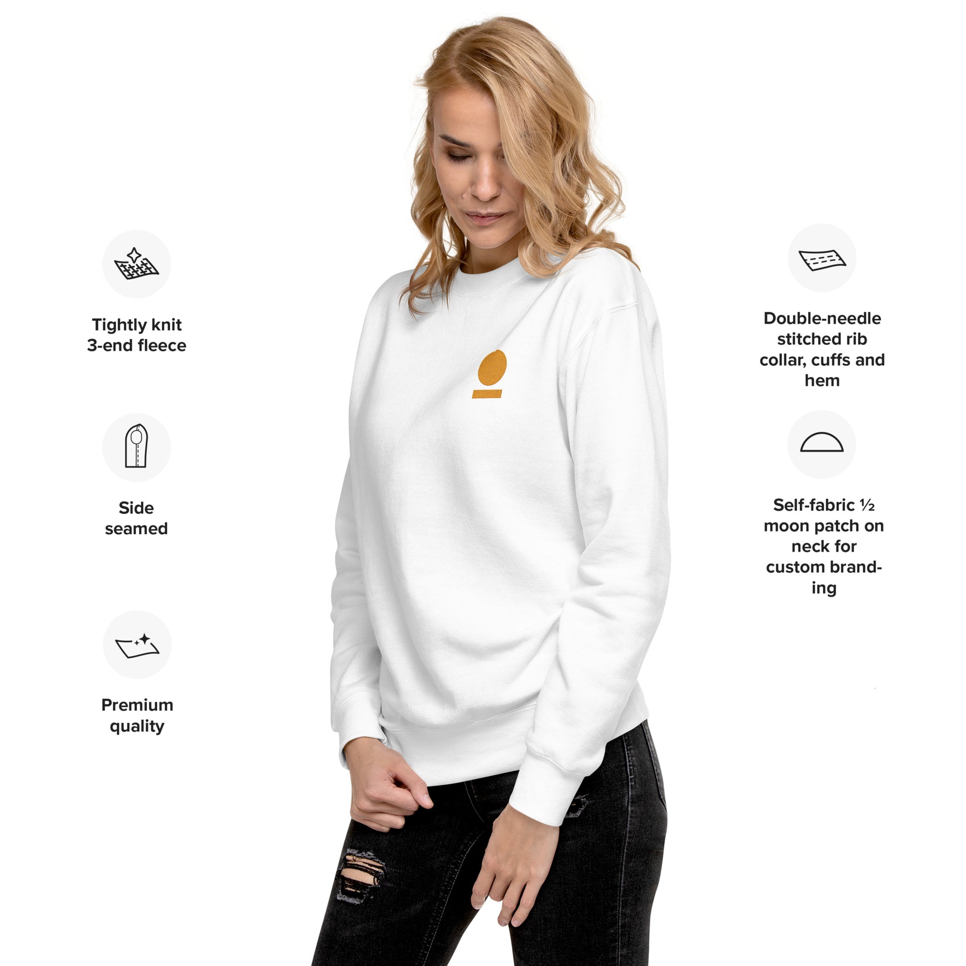 Woman wearing a white STOIC sweatshirt with embroidered logo, standing against a white background with text about sweatshirt features.